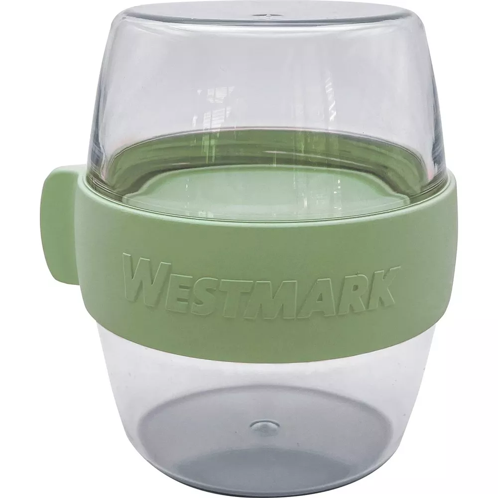 Ein durchsichtiger Behälter mit einem grünen Band und dem Westmark-Logo.