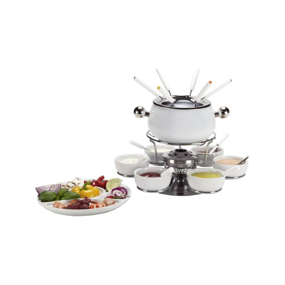 Ein weißes Fondue-Set mit diversen Soßen und einer Platte mit Fleisch und Gemüse.
