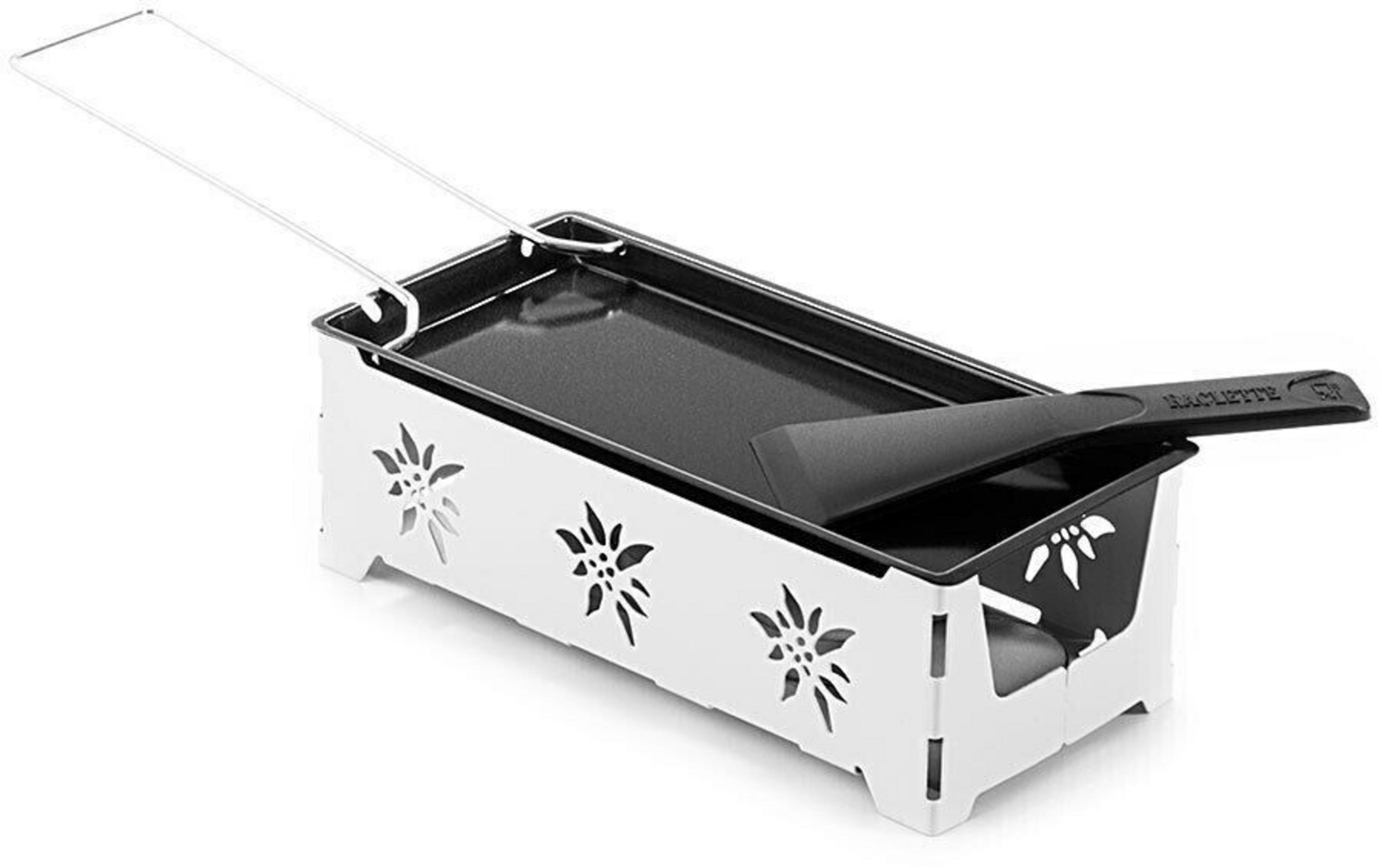 Ein weißer Raclette-Ofen mit Blumenmuster und schwarzer Pfanne.
