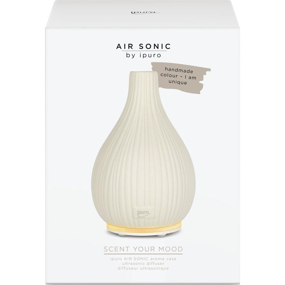 Un vaso bianco scanalato con base luminosa dorata e testo.