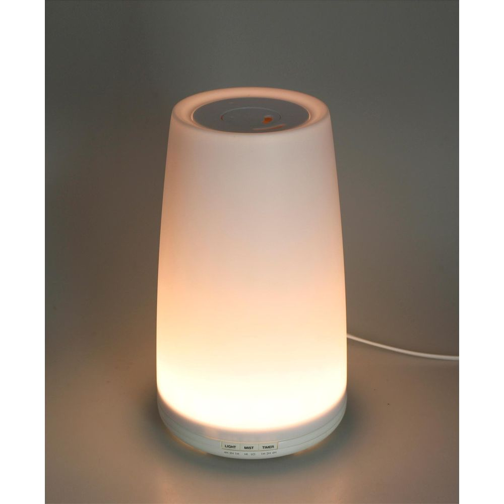 Un diffusore illuminato con pulsanti di controllo alla base.