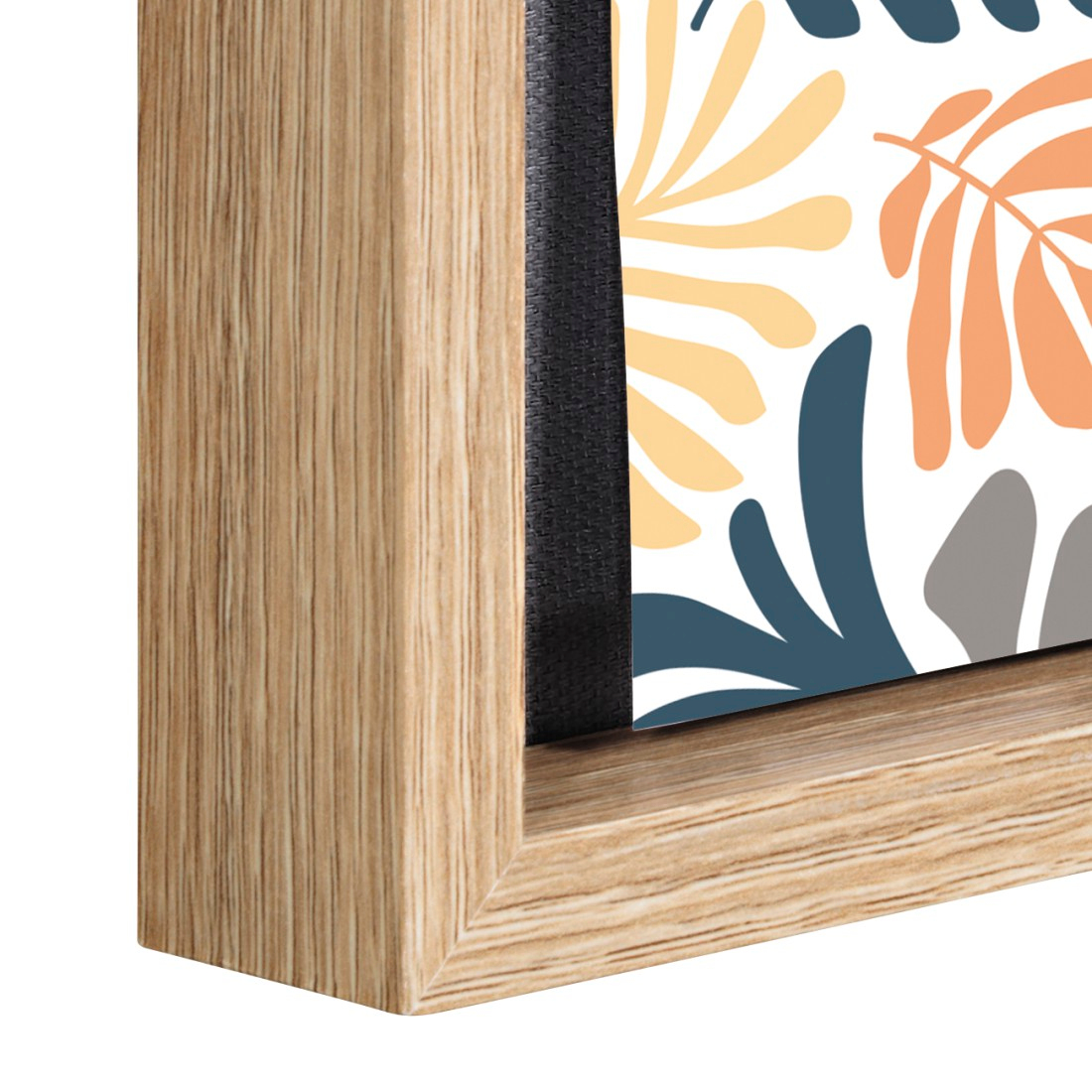 Cadre en bois avec motif abstrait de feuilles orange, jaune et bleu sur blanc.
