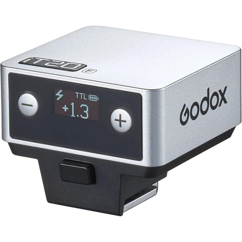 Contrôleur de flash Godox argenté avec écran LCD, boutons +/- et indicateur de batterie TTL.
