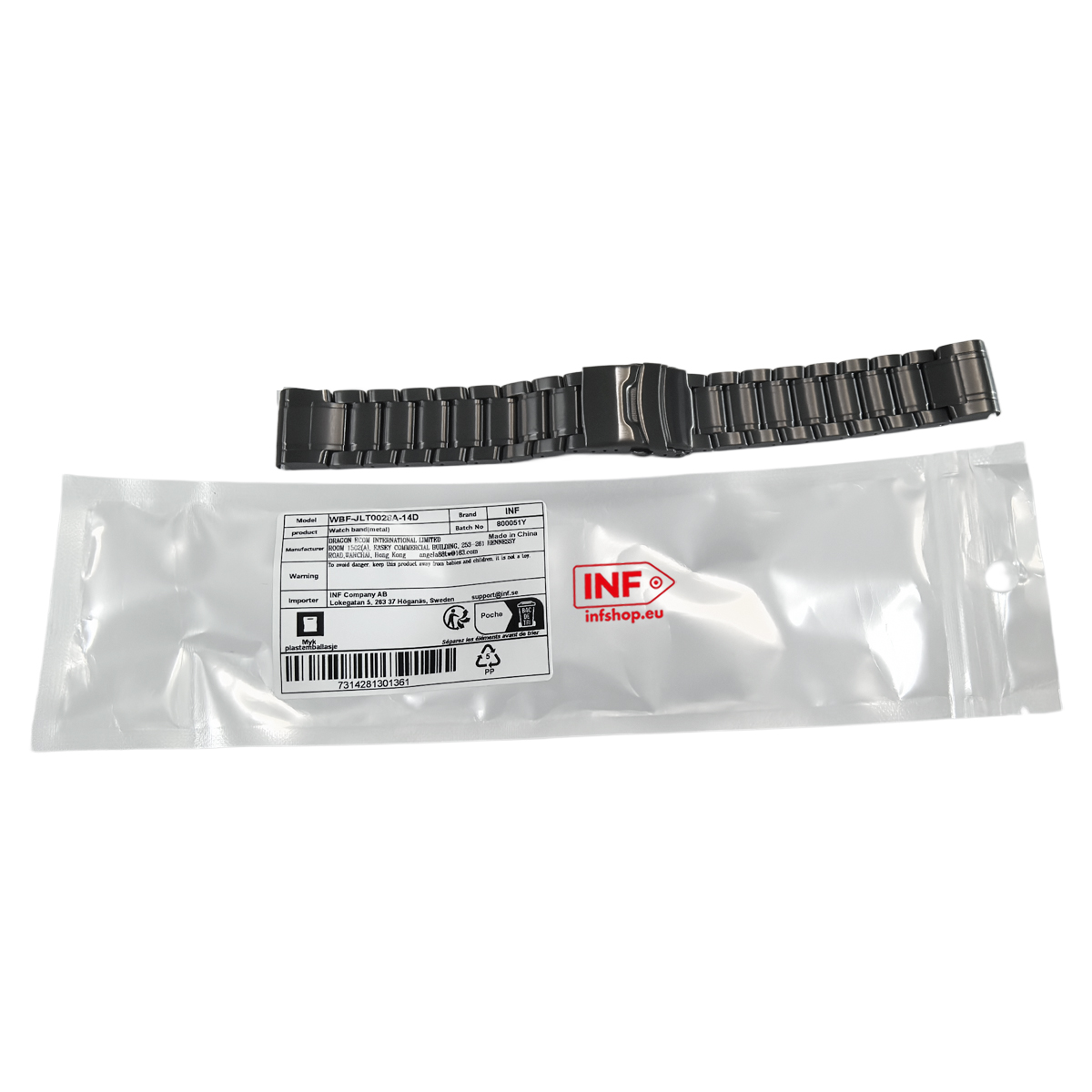 Ein dunkles Metall-Uhrenarmband liegt neben seiner Verpackung.