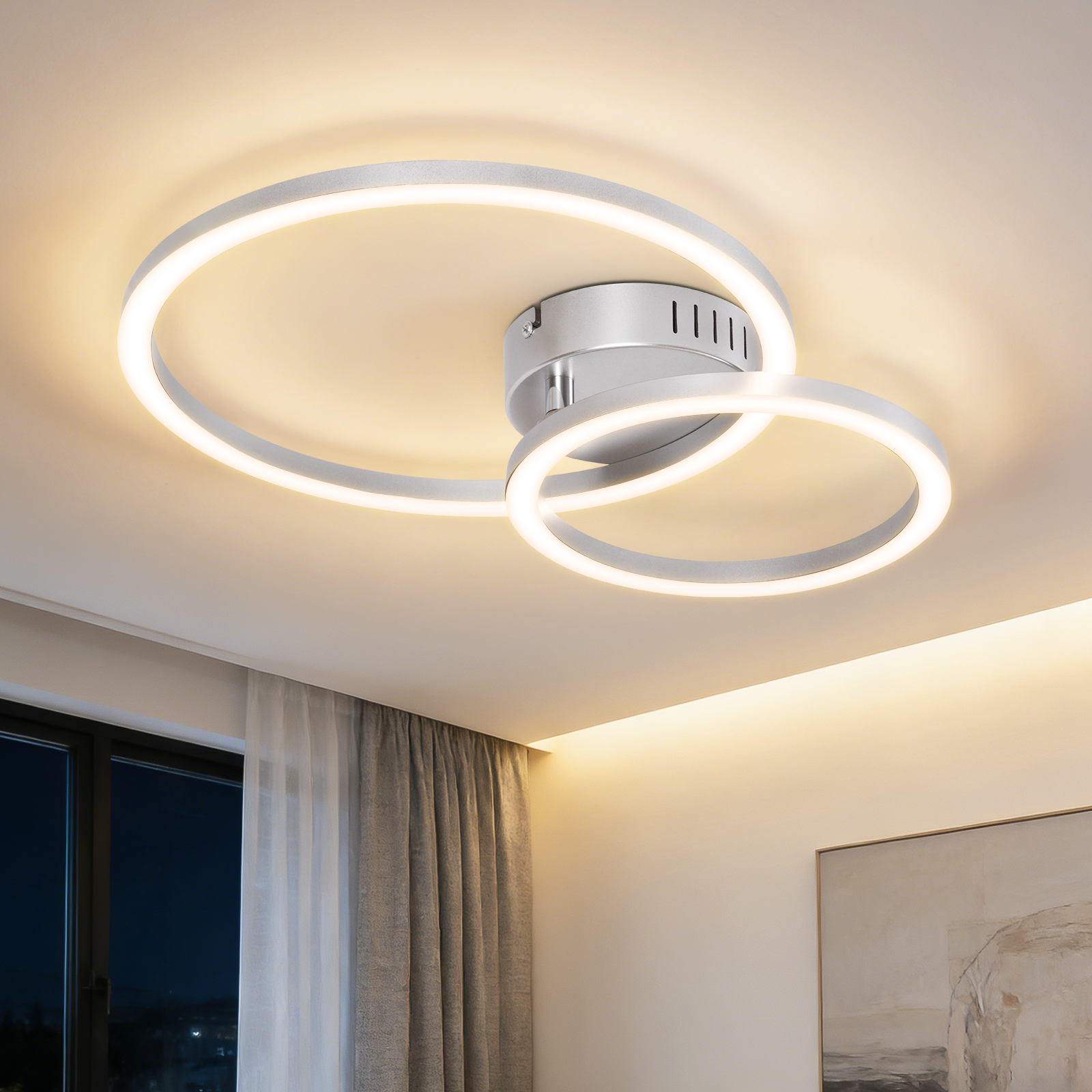 Lampada da soffitto moderna con due anelli bianchi e illuminazione integrata.