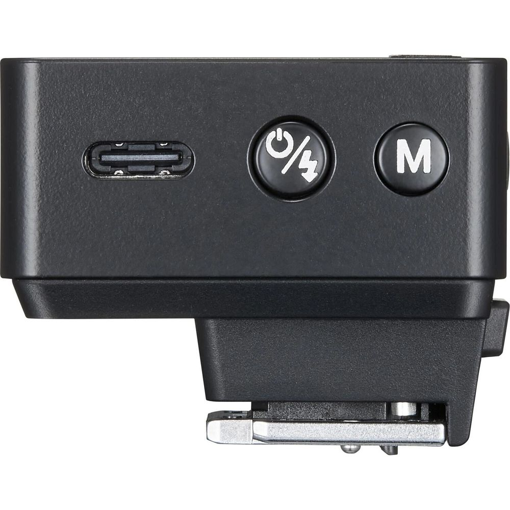 Unité de flash noire avec port USB-C, bouton marche/flash et bouton M.