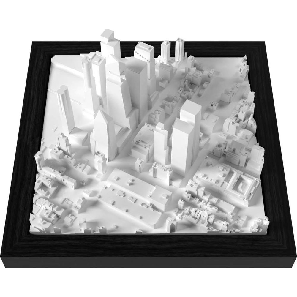 Un modèle 3D de ville blanc avec des gratte-ciel et des bâtiments dans un cadre noir.