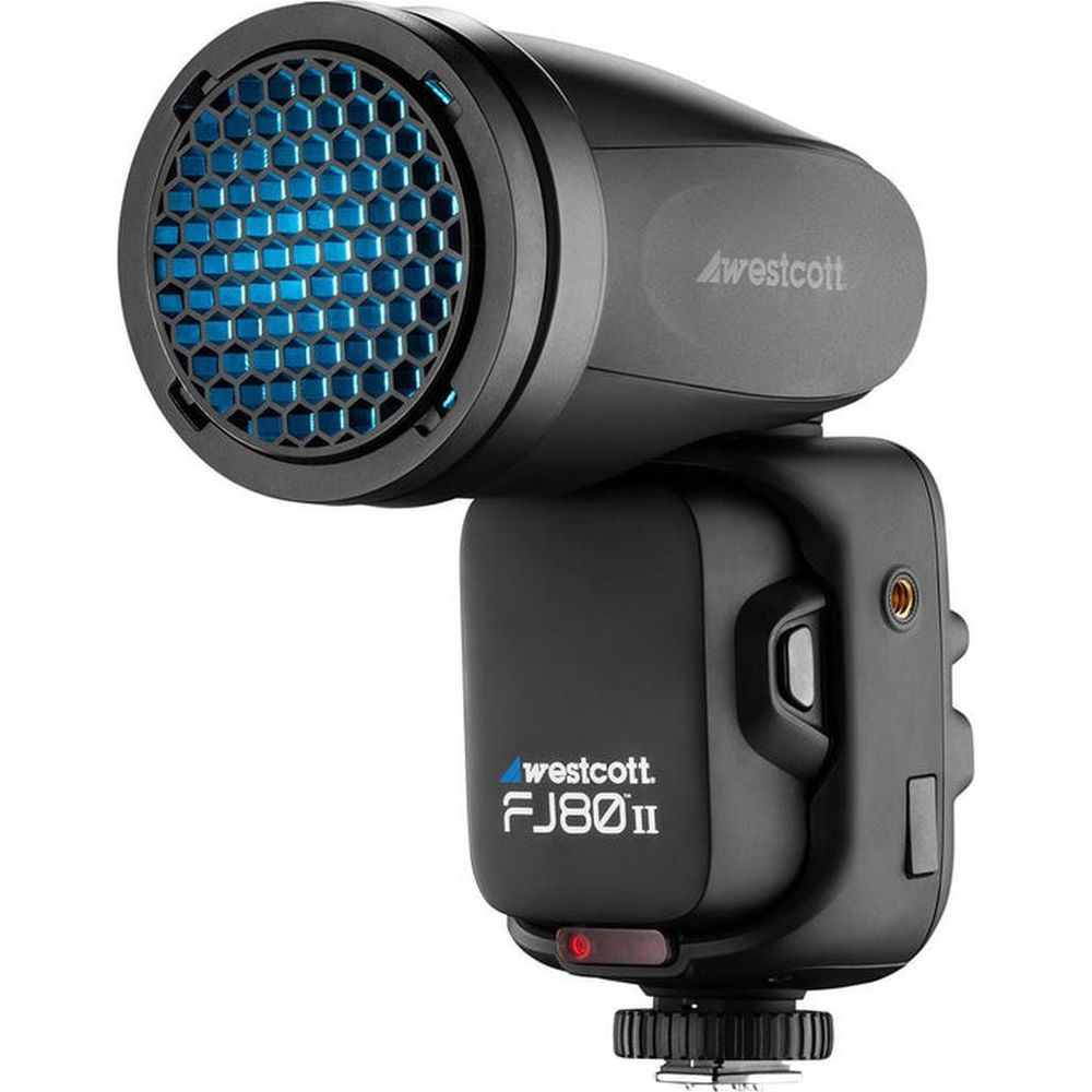 Une tête de flash Westcott FJ80II noire avec une façade en nid d'abeille bleue.