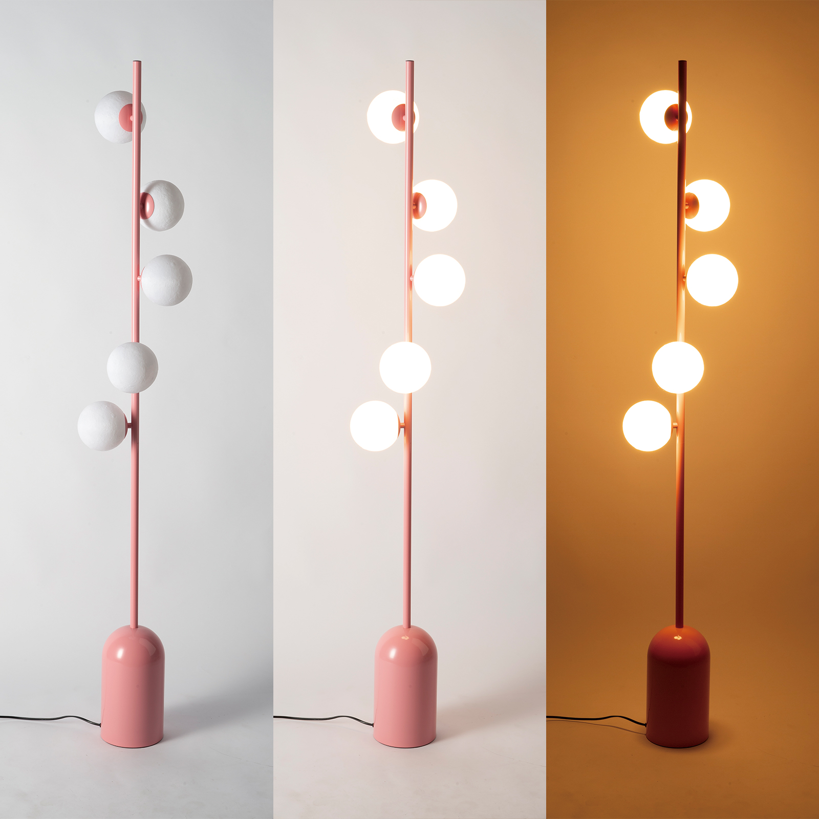 Lámpara de pie rosa con cinco esferas, tres apagadas, dos encendidas.