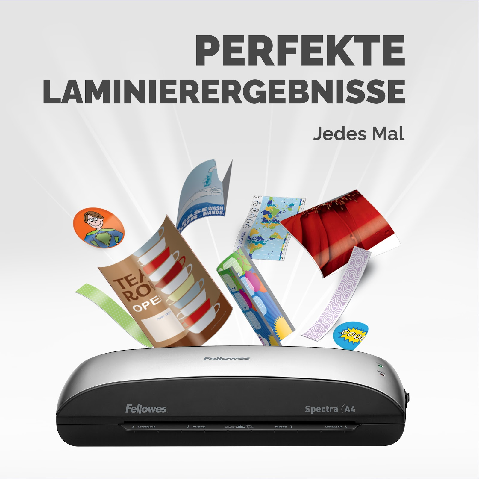 Laminator Fellowes Spectra A4 z laminowanymi dokumentami, takimi jak filiżanki, mapy i komiksy.