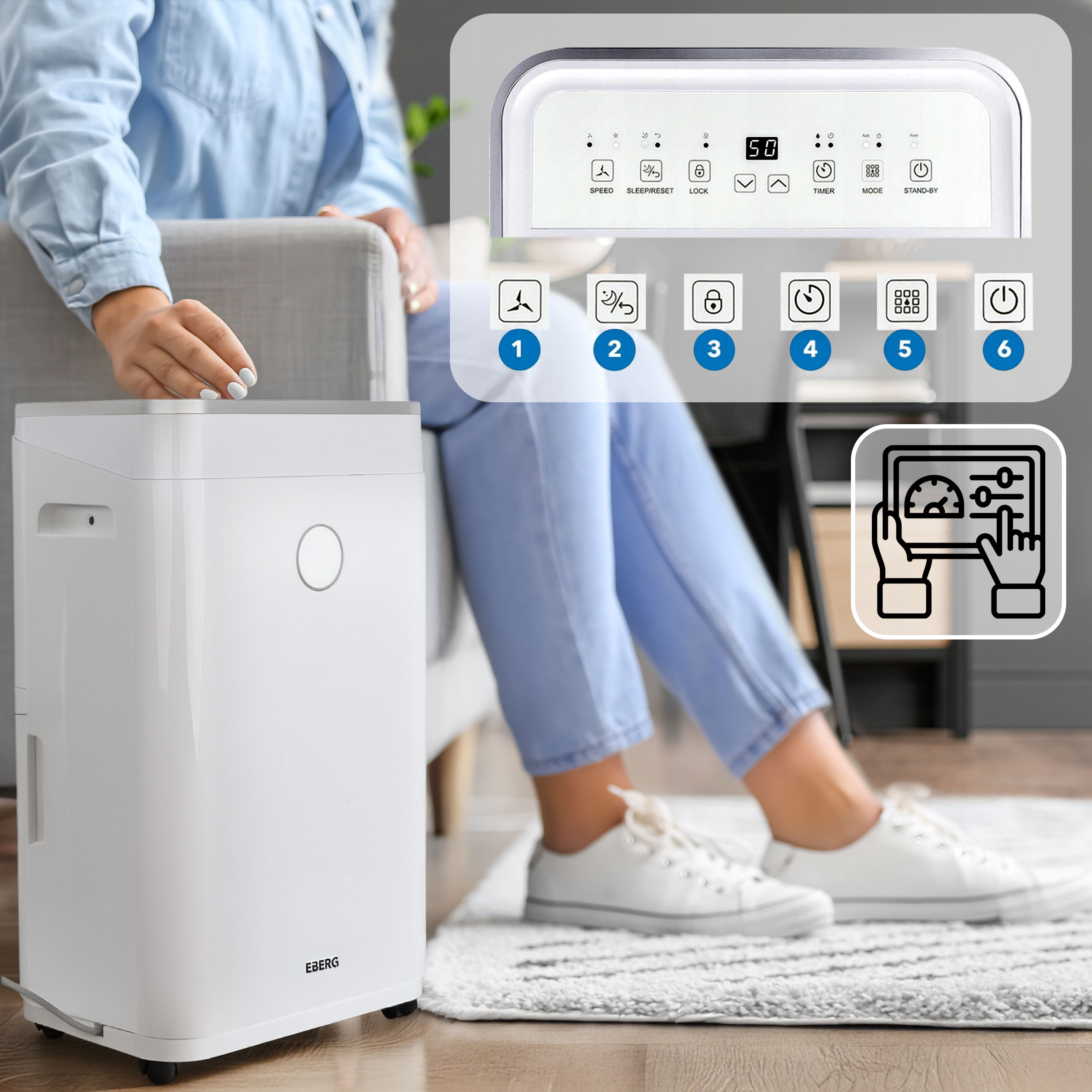 Osoba w niebieskich dżinsach i białych tenisówkach obsługuje biały osuszacz powietrza.