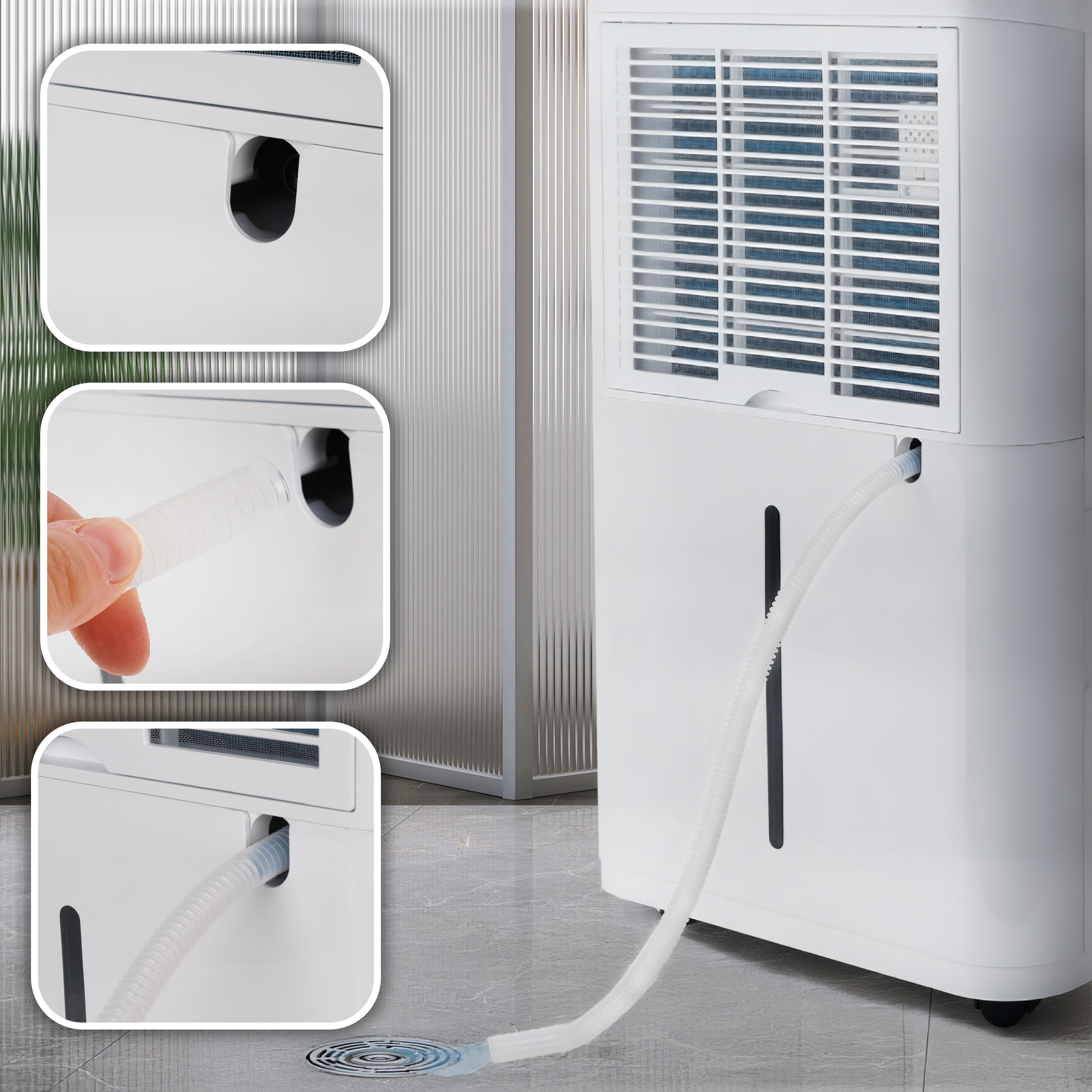 Biały osuszacz powietrza z wężem prowadzącym do odpływu podłogowego.