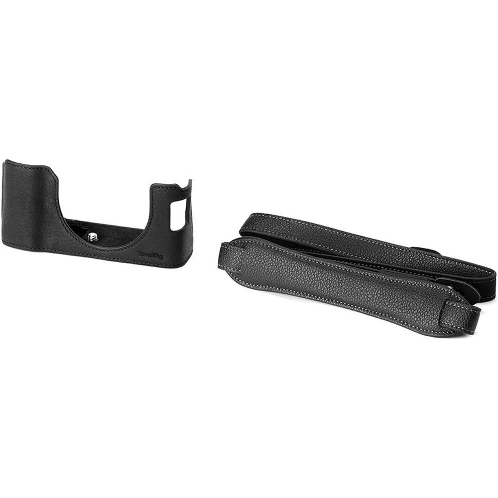 Black leather camera grip case and strap on a white background.