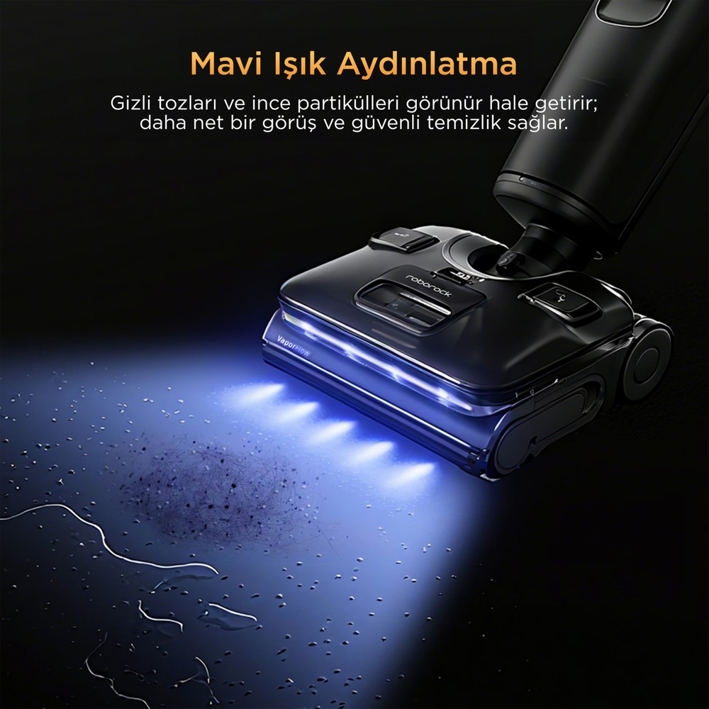Una aspiradora Roborock negra con luz azul que ilumina polvo y suciedad en el suelo.