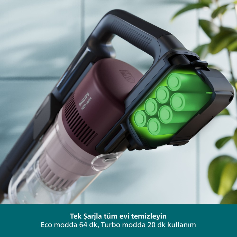 Parlak yeşil pillerle Philips süpürge. Altta yazı var.