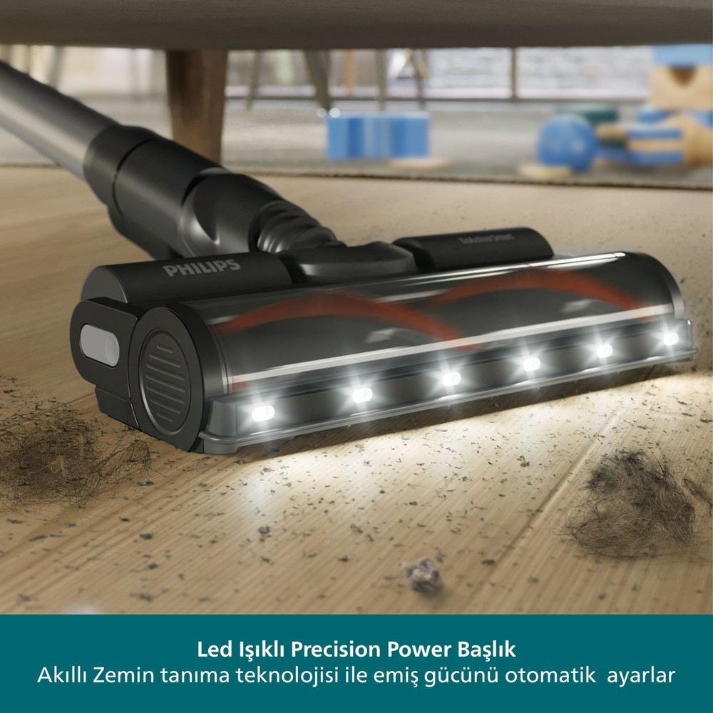 LED'li Philips Precision Power başlık ahşap zemini toz ve saçla temizliyor.
