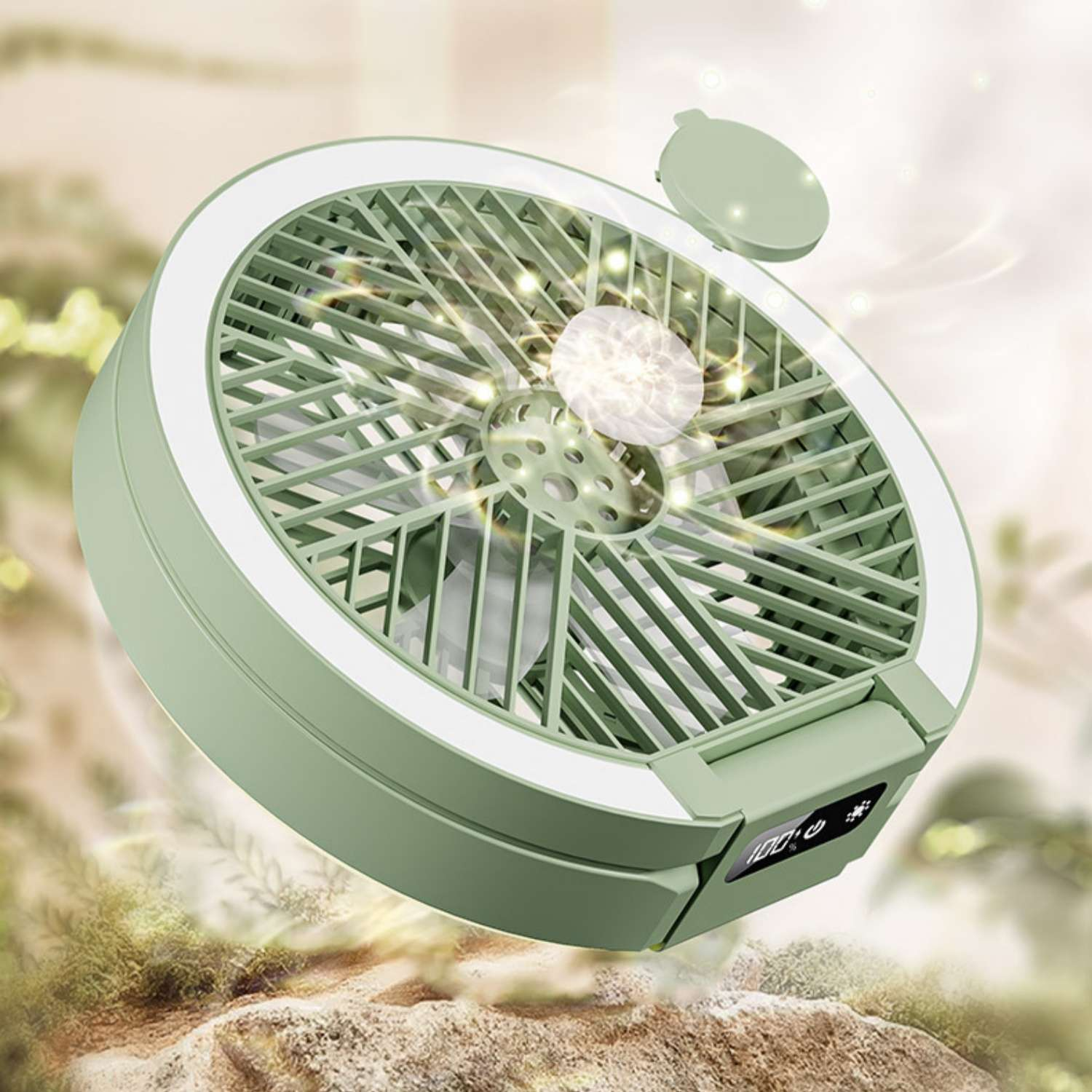 Ein grüner tragbarer Ventilator mit weißem LED-Ring, der 100 % auf einem kleinen Bildschirm anzeigt.