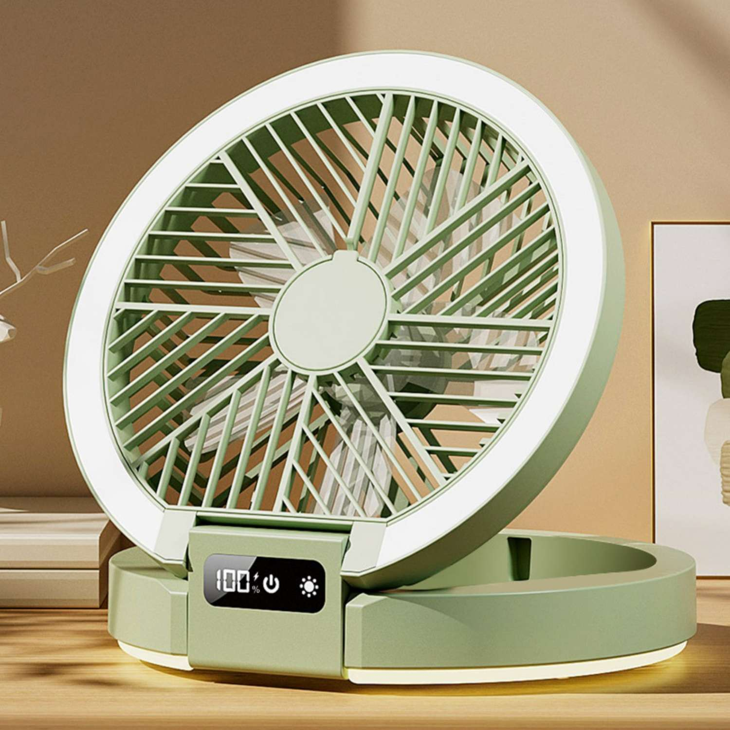 Ein tragbarer grüner Ventilator mit weißem Ringlicht und Digitalanzeige (100%).