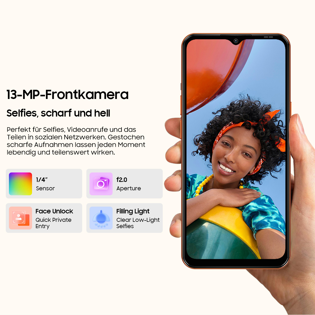 Un telefono con fotocamera frontale da 13 MP mostra un selfie di una donna con capelli ricci.