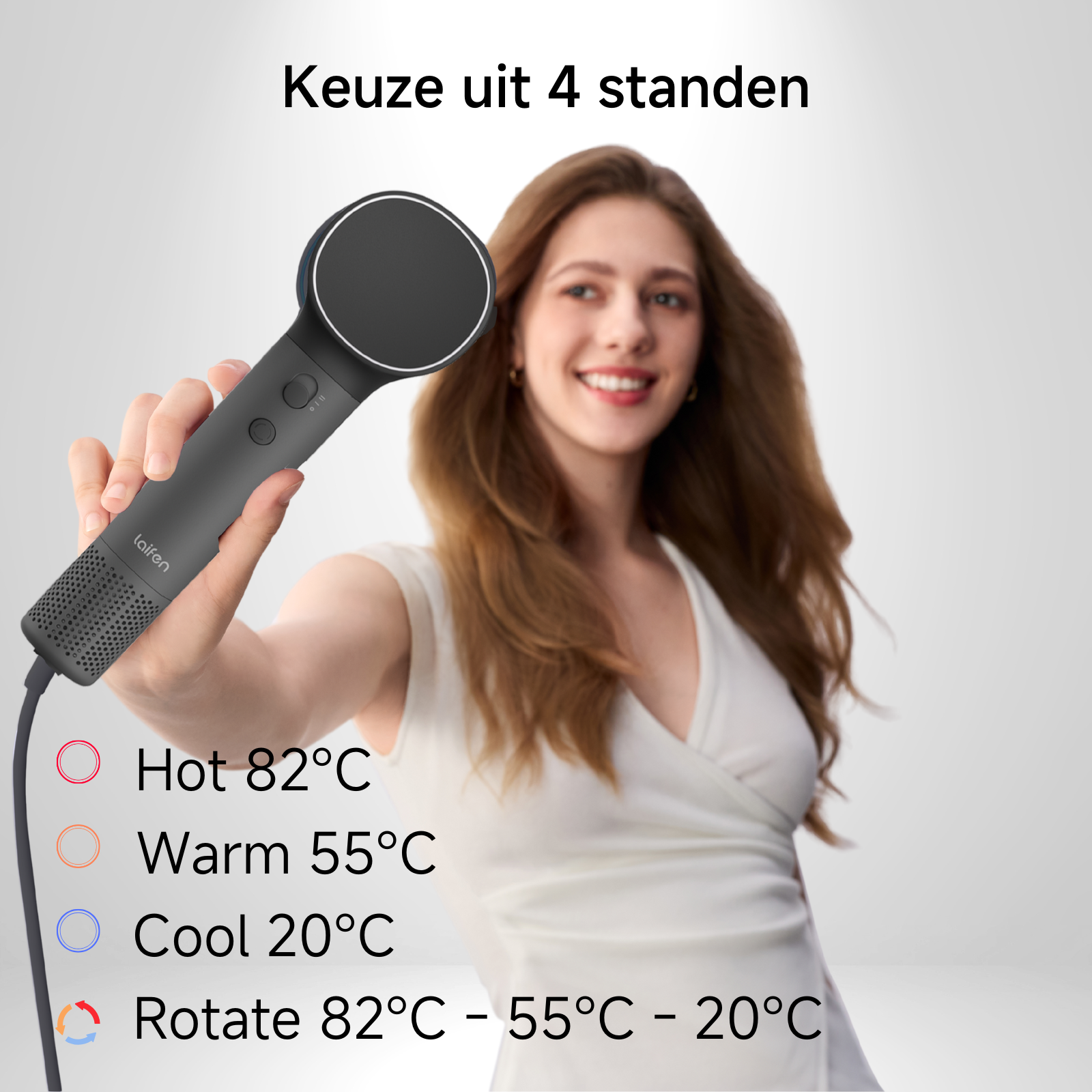 Donna tiene un asciugacapelli con quattro impostazioni di temperatura: calda, tiepida, fredda e rotante.