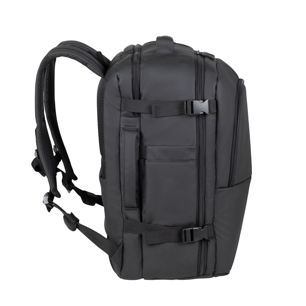 Black backpack with padded straps and buckles, made of fabric.