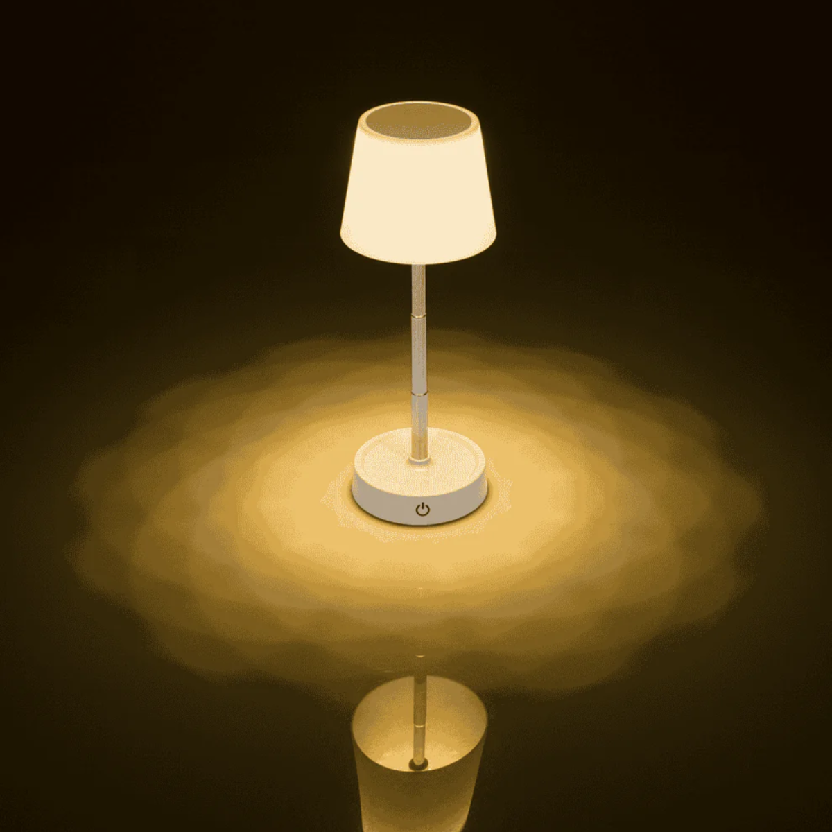 A white bedside lamp with a round base and a conical shade is illuminated.