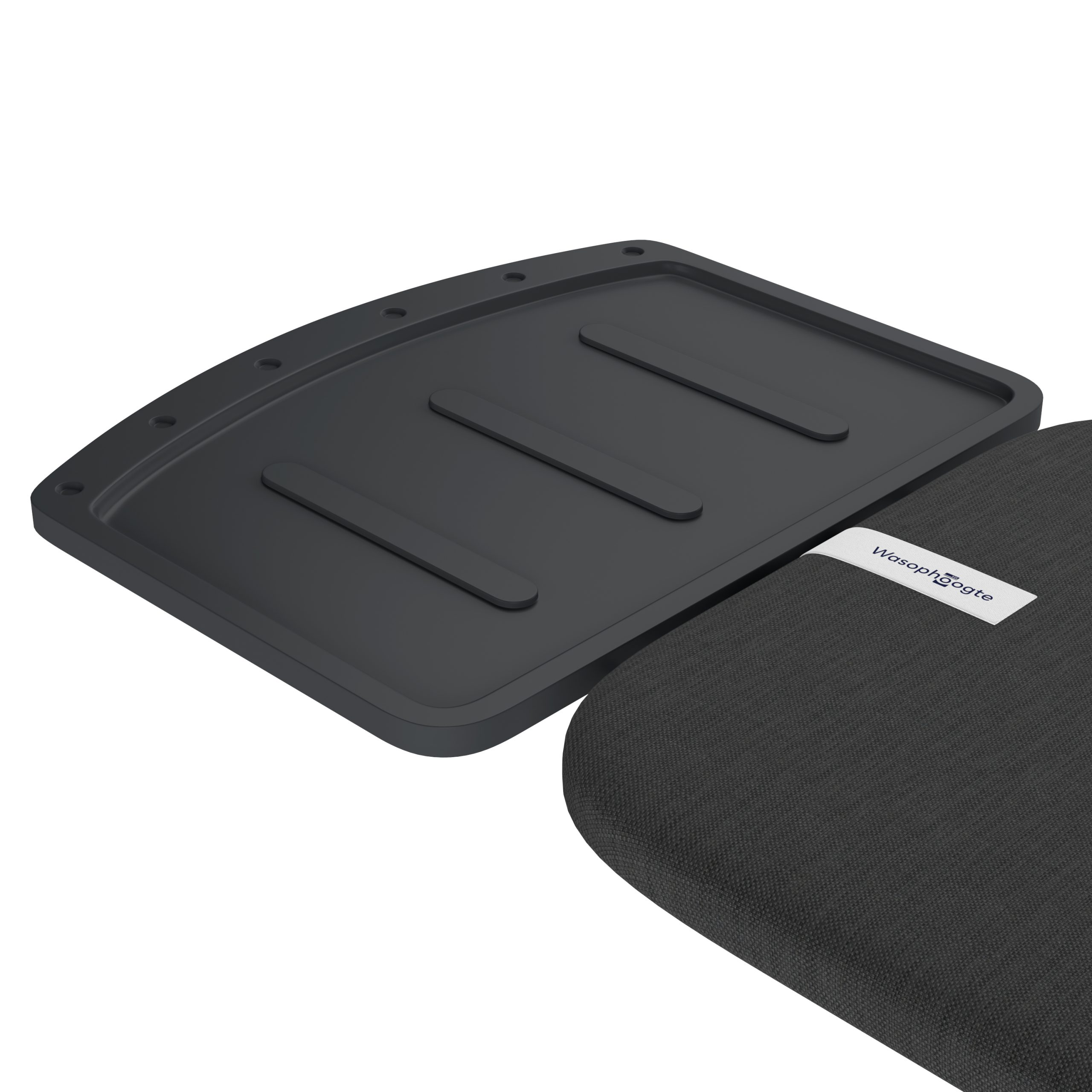 A black plastic part with three raised strips and holes lies next to gray fabric.