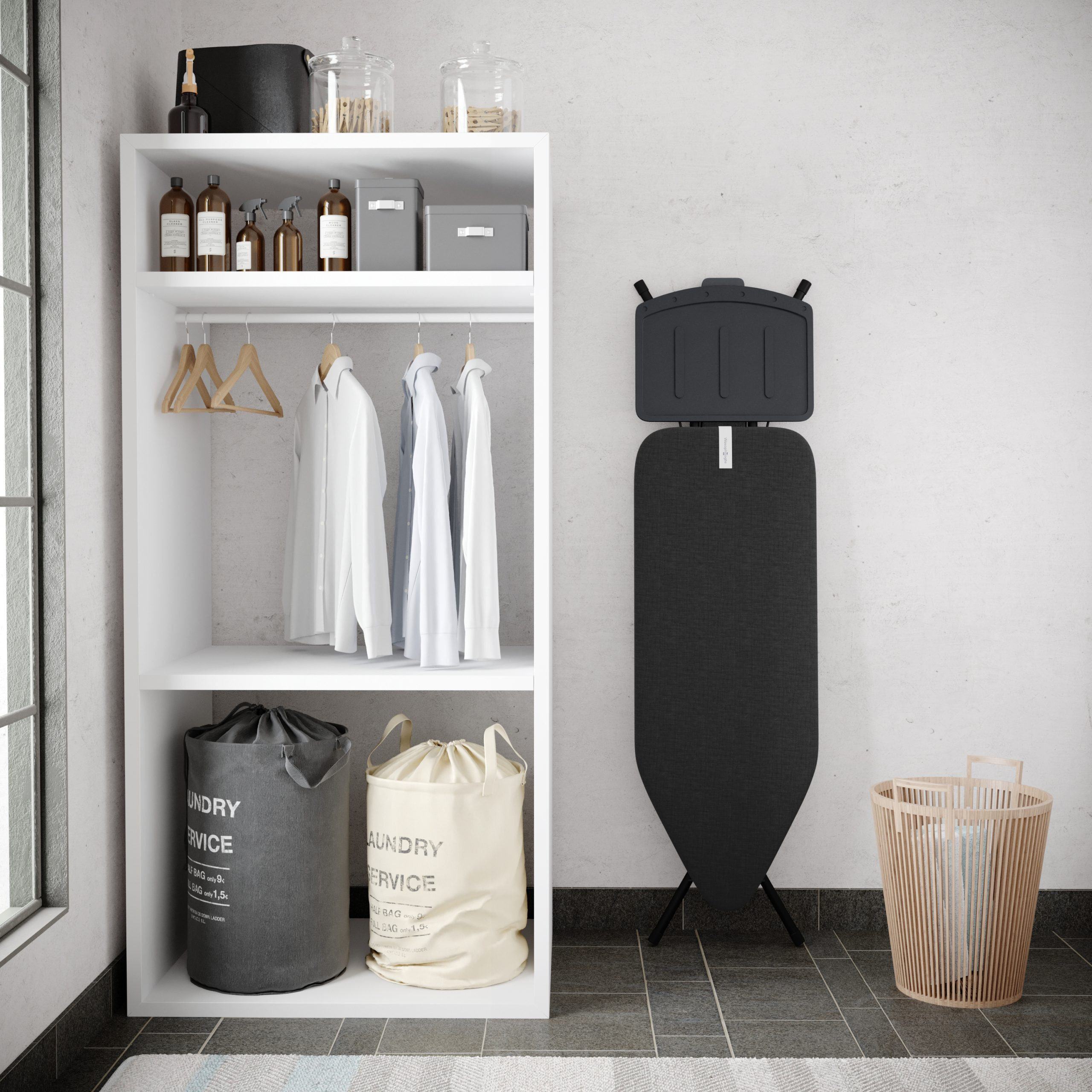 A white shelf holds clothes, laundry baskets, and an ironing board nearby.