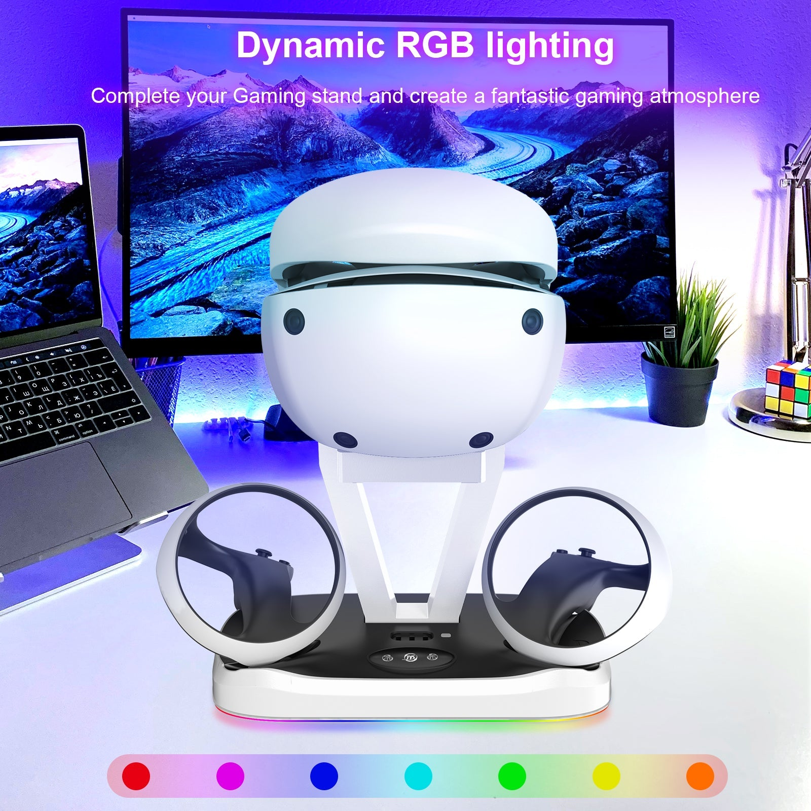 Wit oplaaddock voor VR-headset met controllers, laptop en monitor.