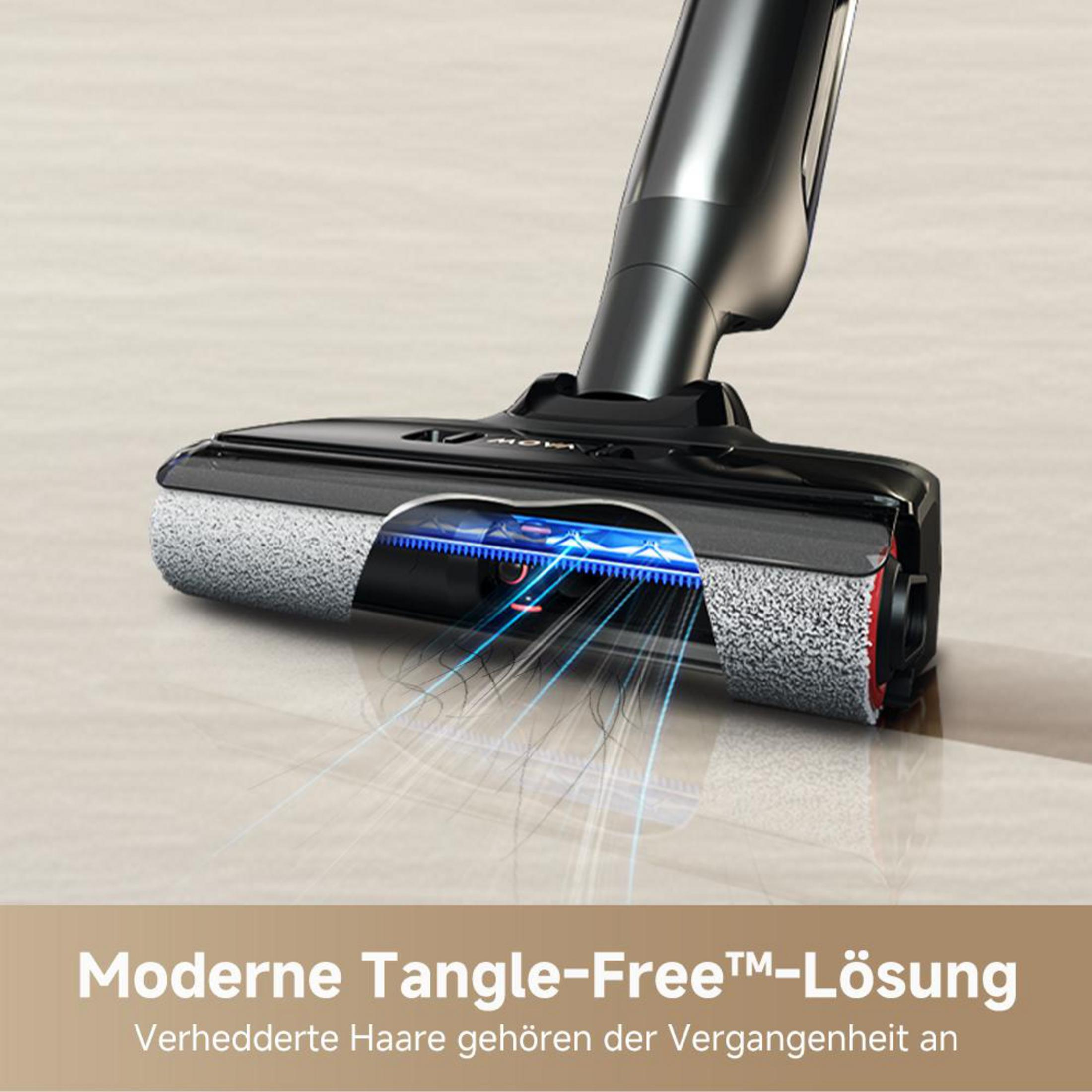 Tête d'aspirateur avec brosses rotatives ramassant les cheveux.