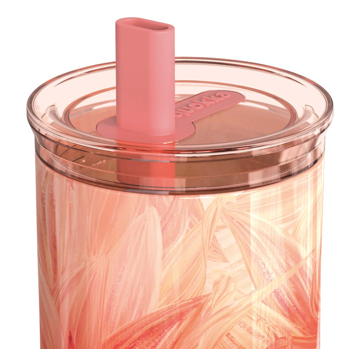 Un bicchiere trasparente con cannuccia rosa e motivo astratto.