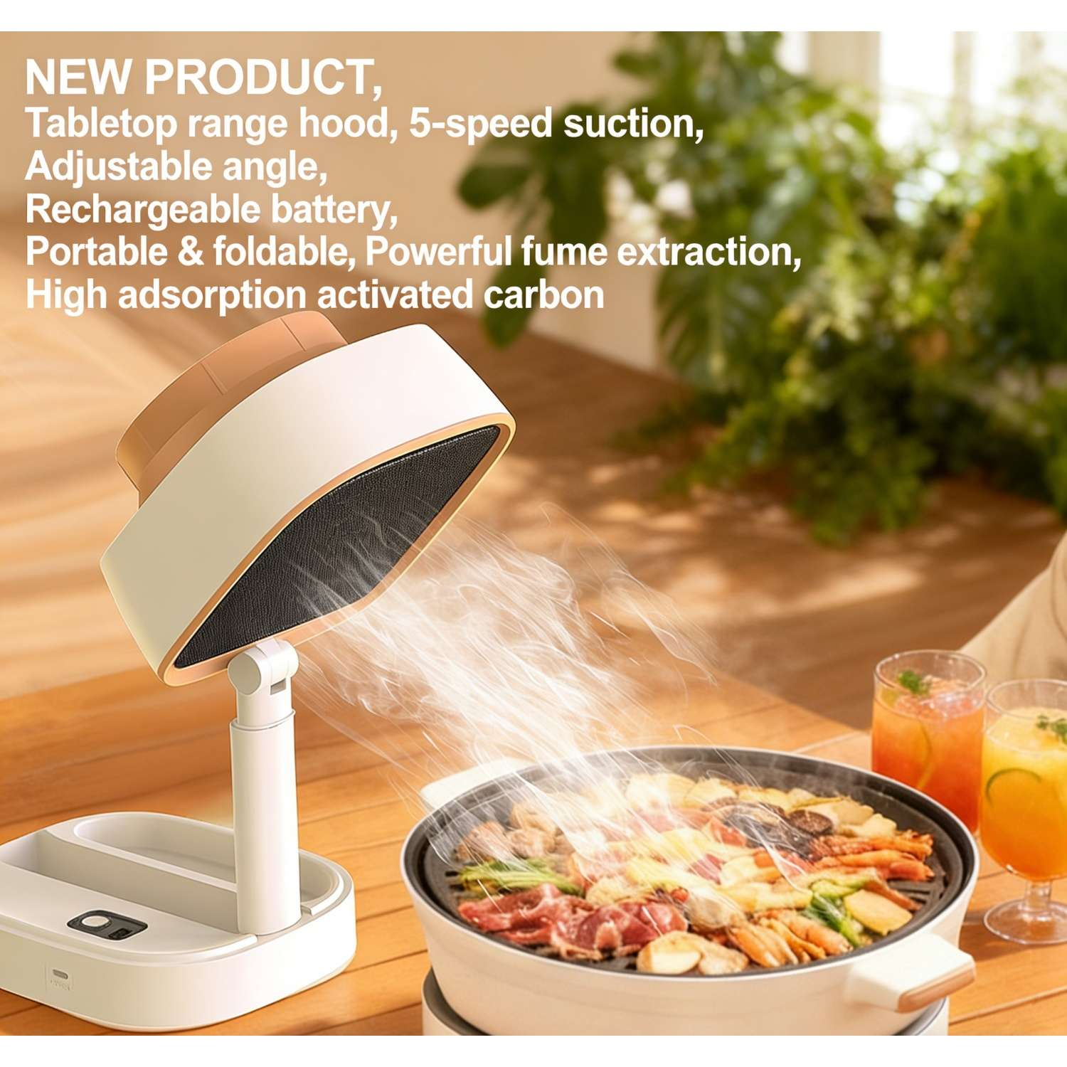 Tragbare Dunstabzugshaube über Grill mit Essen und Getränken. Weiße Haube mit beige Akzenten.