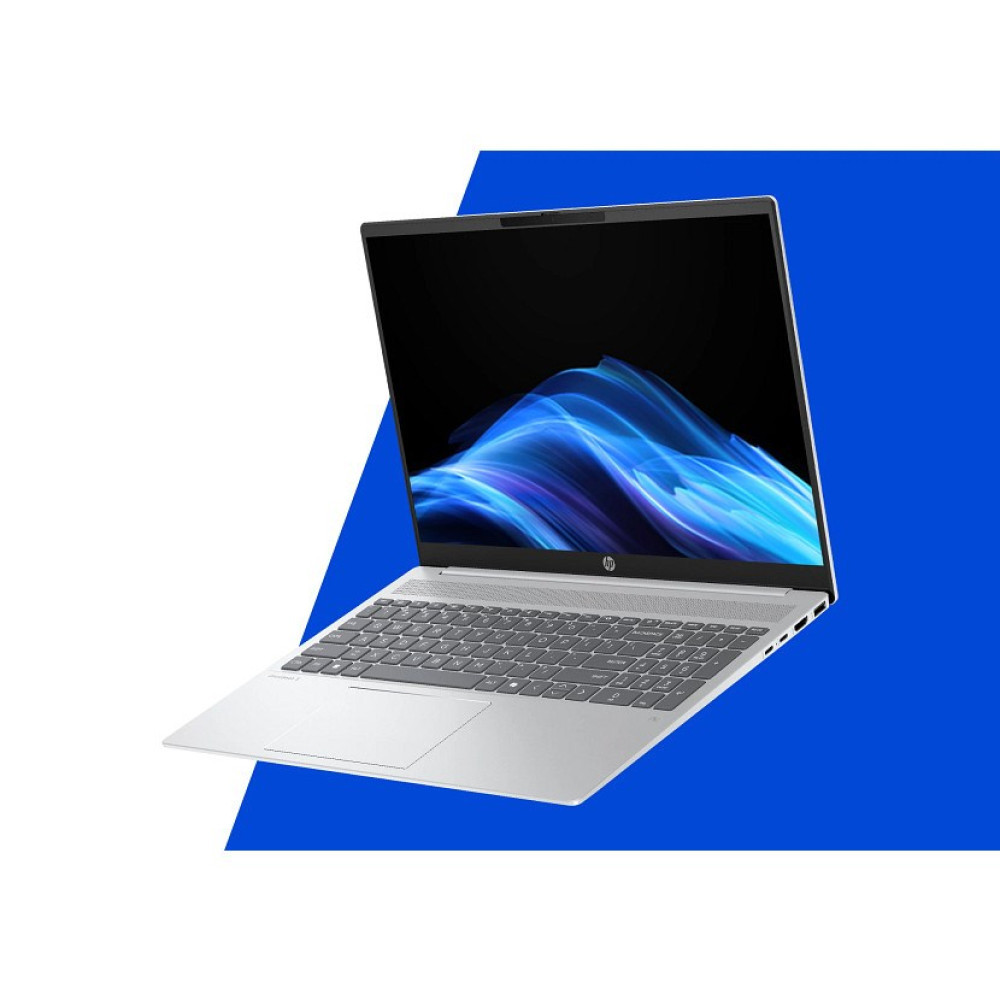 Otwarty srebrny laptop na niebiesko-białym tle z abstrakcyjną niebieską tapetą ekranu.