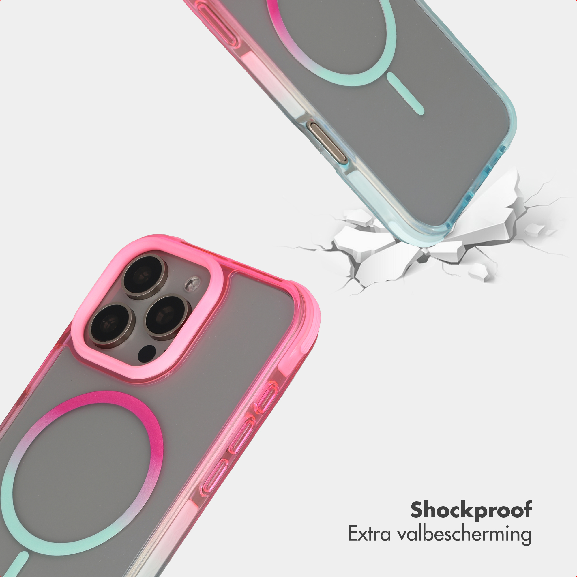 Twee schokbestendige telefoonhoesjes, roze en blauw, vallen op gebroken grond.