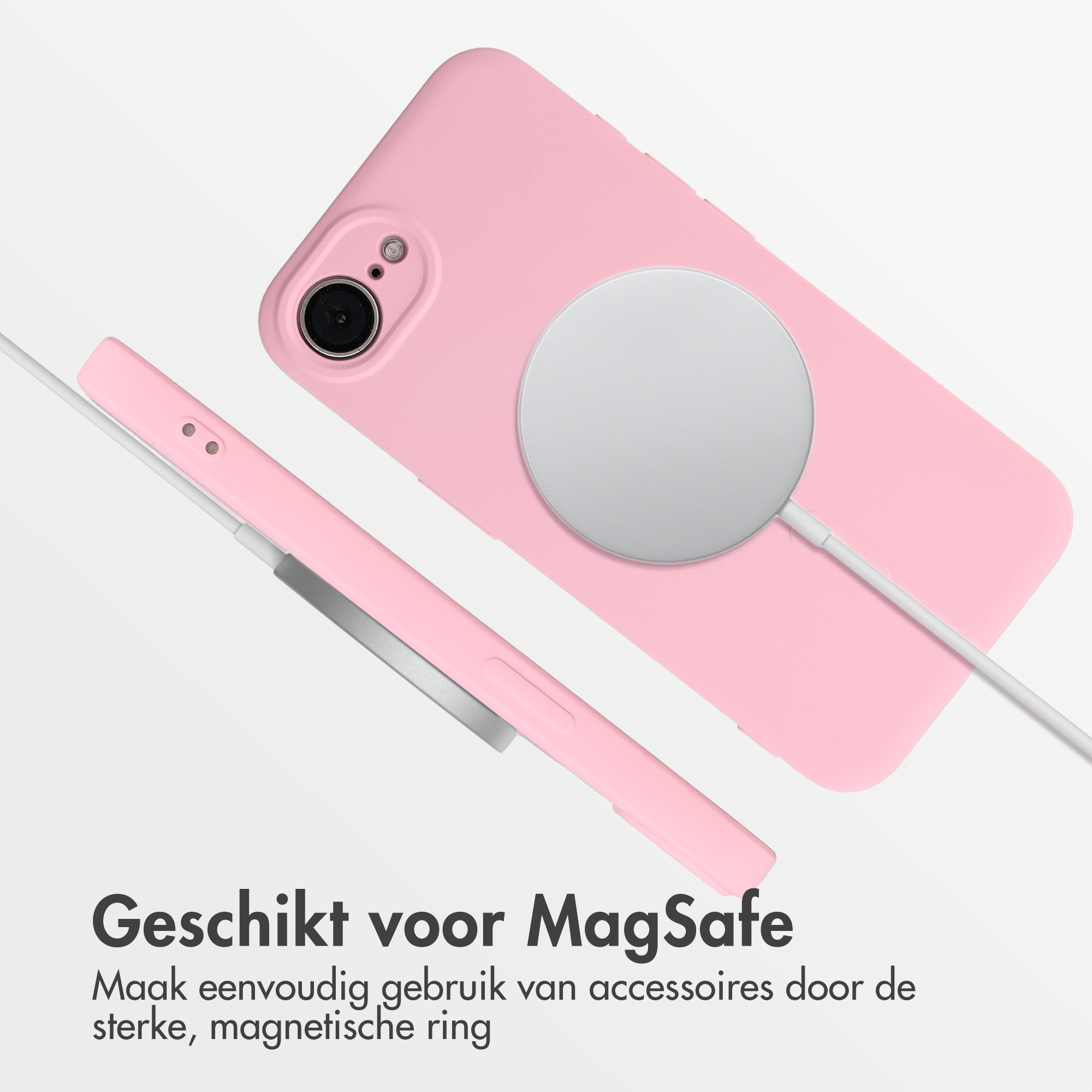Een roze telefoonhoesje met MagSafe oplader en kabel op witte achtergrond.