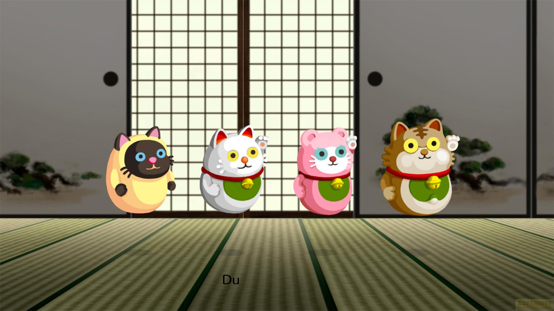 Cuatro figuras de gatos estilizadas con campanas en una habitación japonesa.