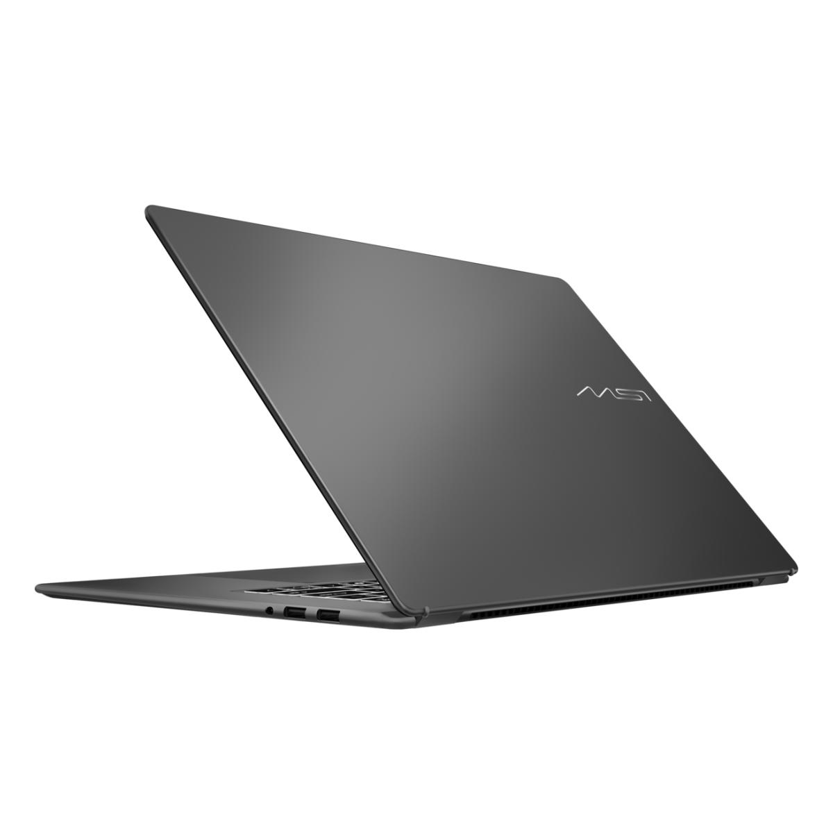 Un ordinateur portable MSI gris foncé est ouvert, montrant le clavier et les ports. Le capot est incliné vers l'arrière.