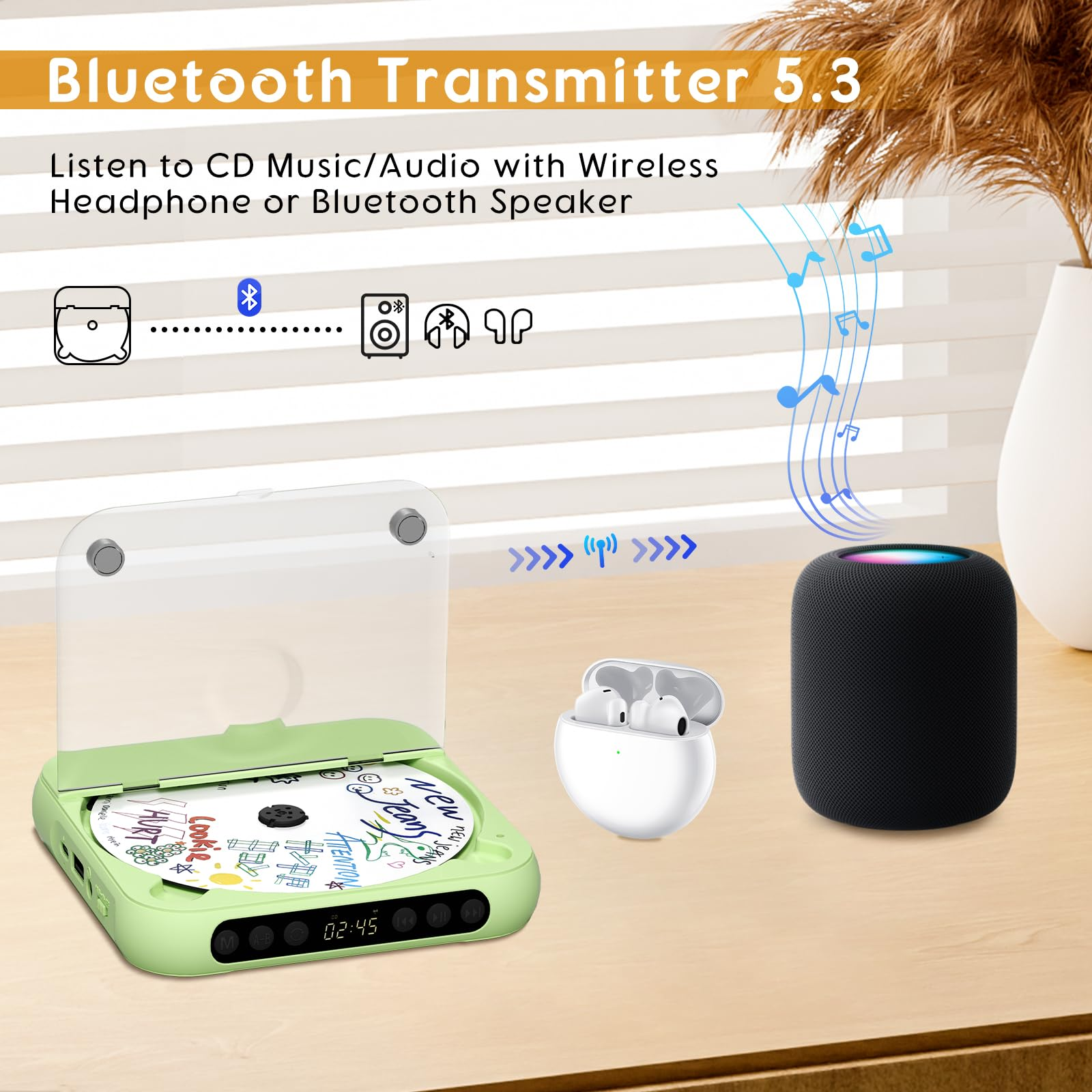 Ein grüner CD-Player mit CD, Ohrhörern und schwarzem Lautsprecher.