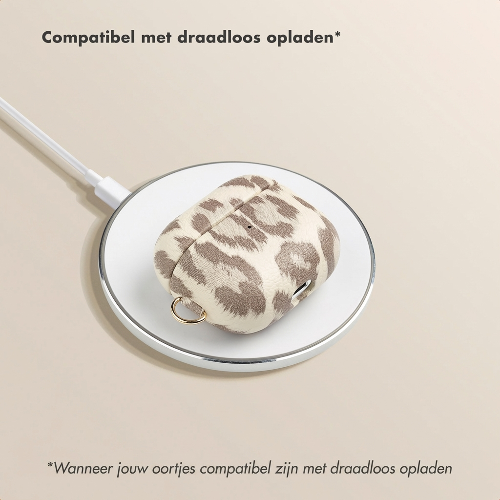 A leopard print case for AirPods charging wirelessly.
