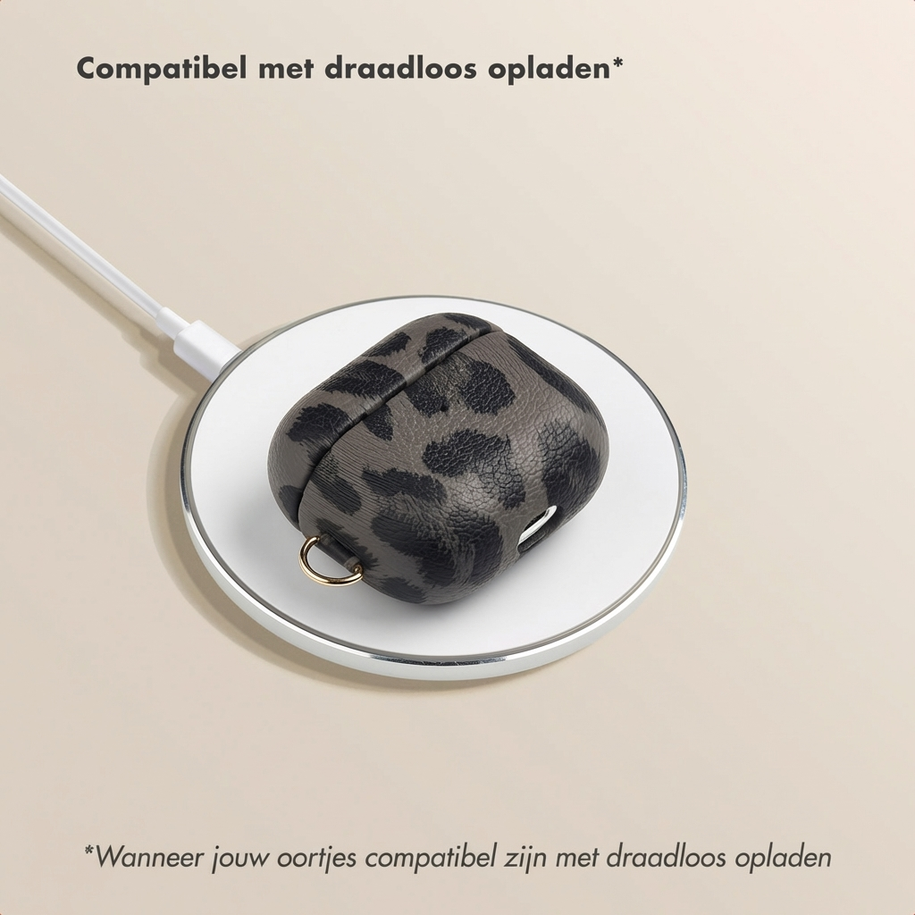 Gray leopard print case on a wireless charger.