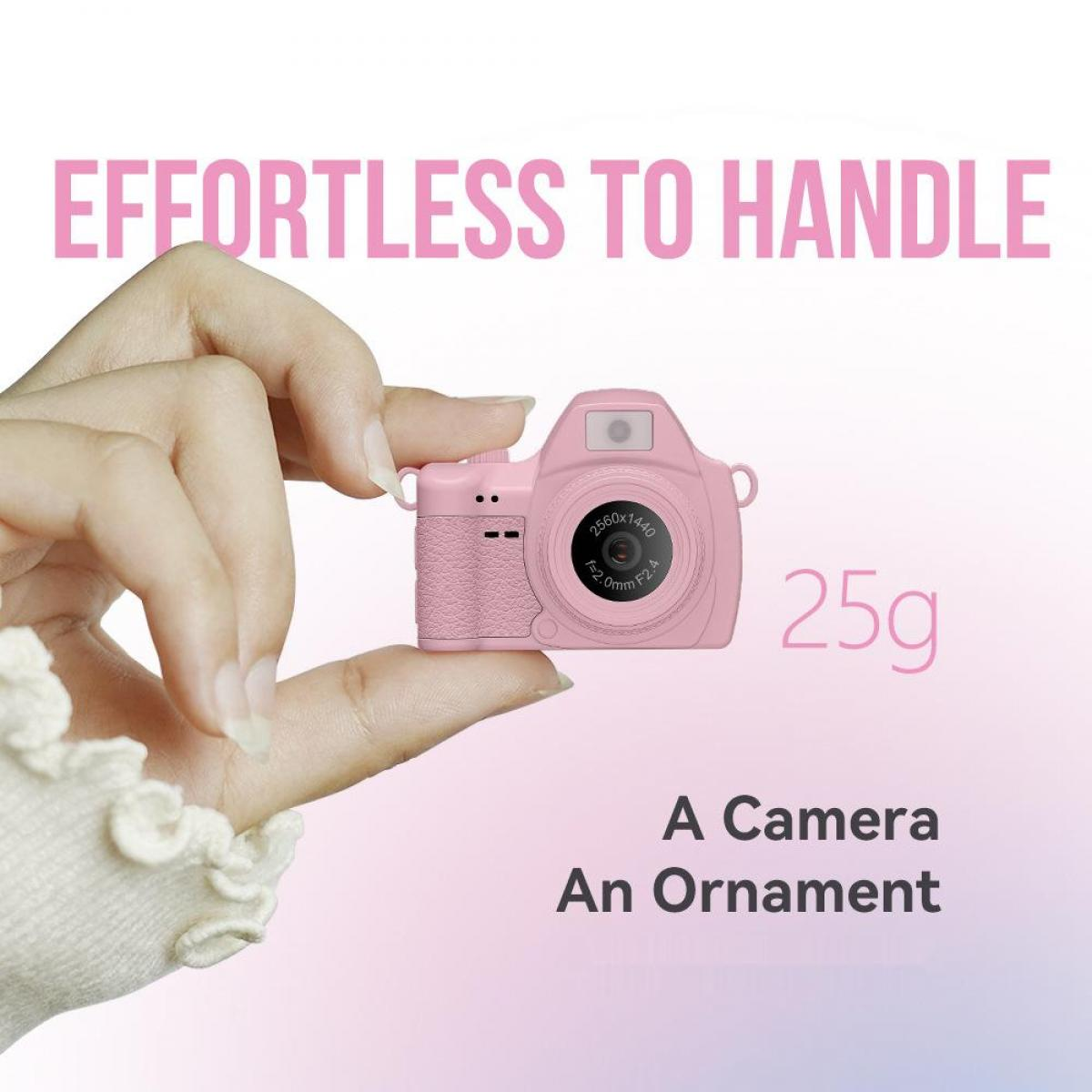 Eine Hand hält eine kleine rosa Kamera mit 25g Gewicht.