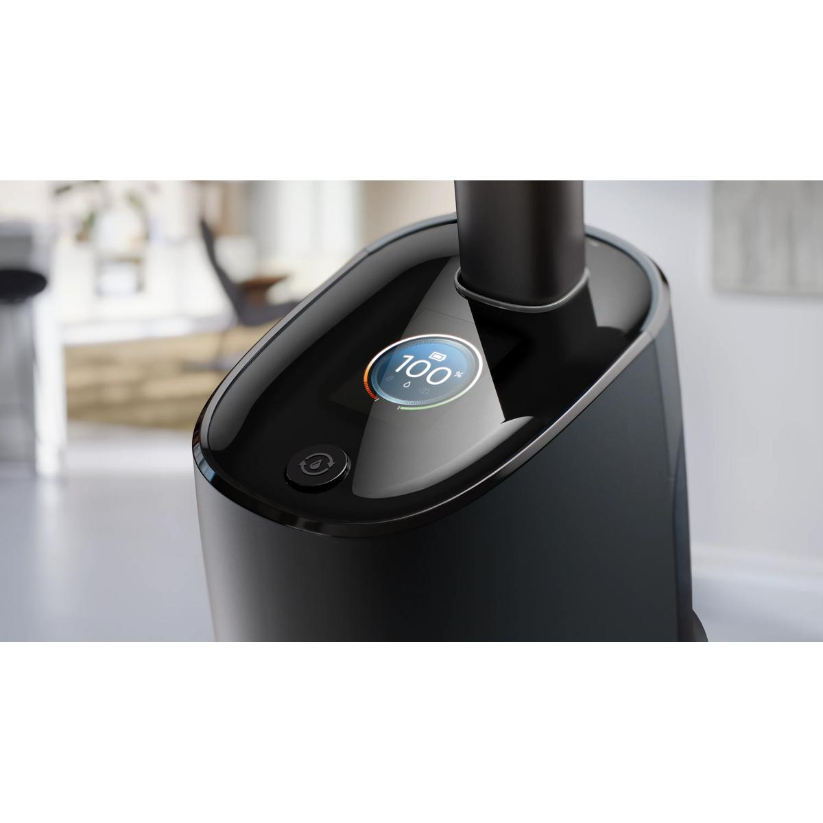 Czarna parownica do ubrań ze wskaźnikiem baterii 100% i przyciskiem.