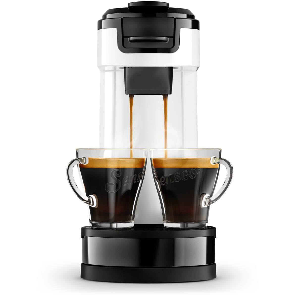 Kaffeemaschine brüht zwei Tassen Espresso in Glasbehältern.