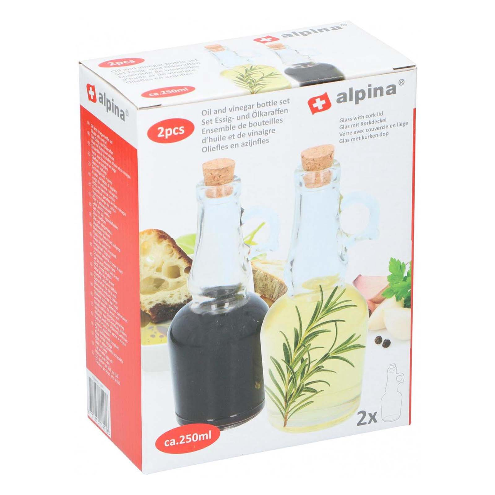 Due bottiglie di vetro con tappo in sughero, una per olio con rosmarino, una per aceto.