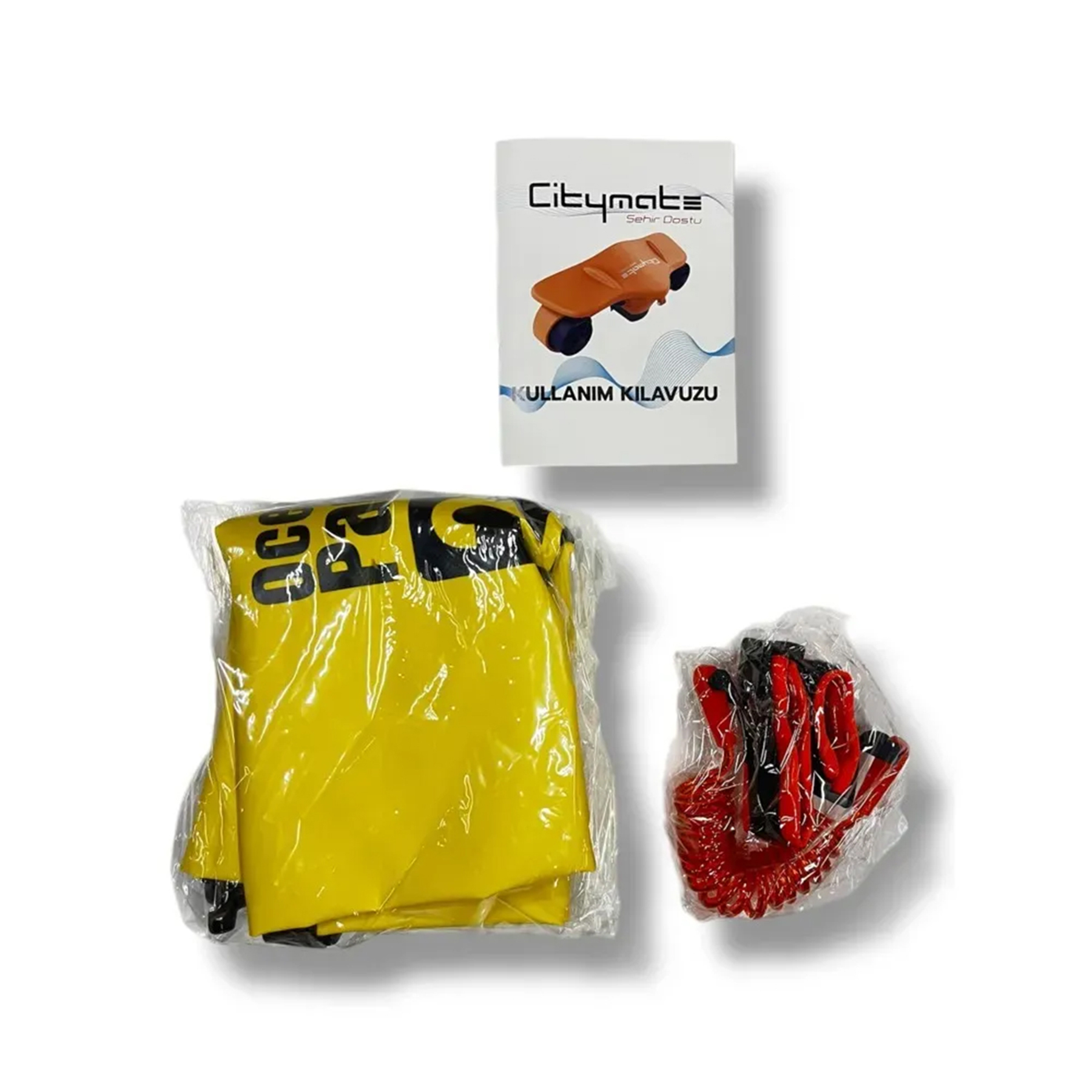 Sarı bir paket, turuncu bir scooter'lı kılavuz ve kırmızı/siyah kablolar.