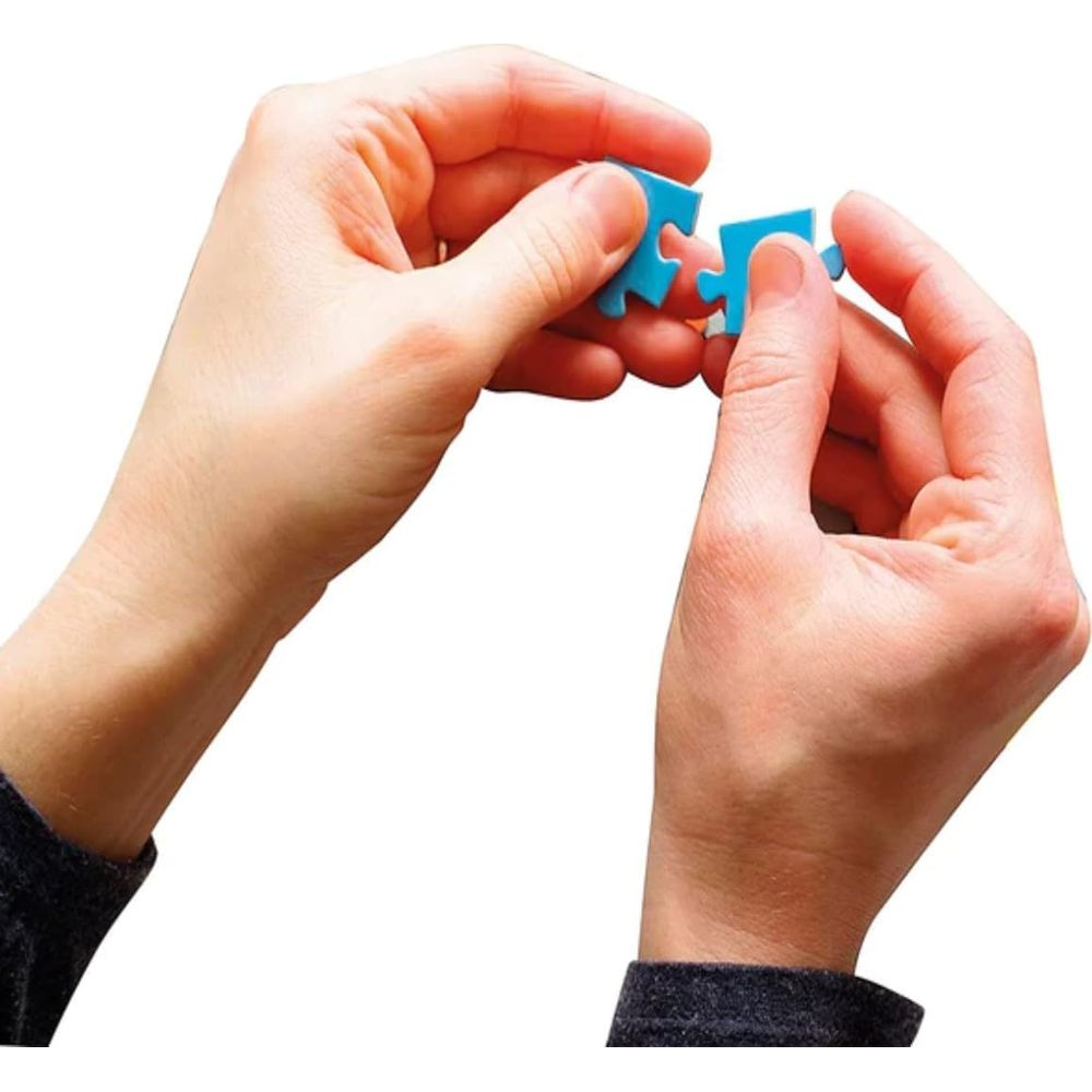 Two hands connecting two blue puzzle pieces against a white background.