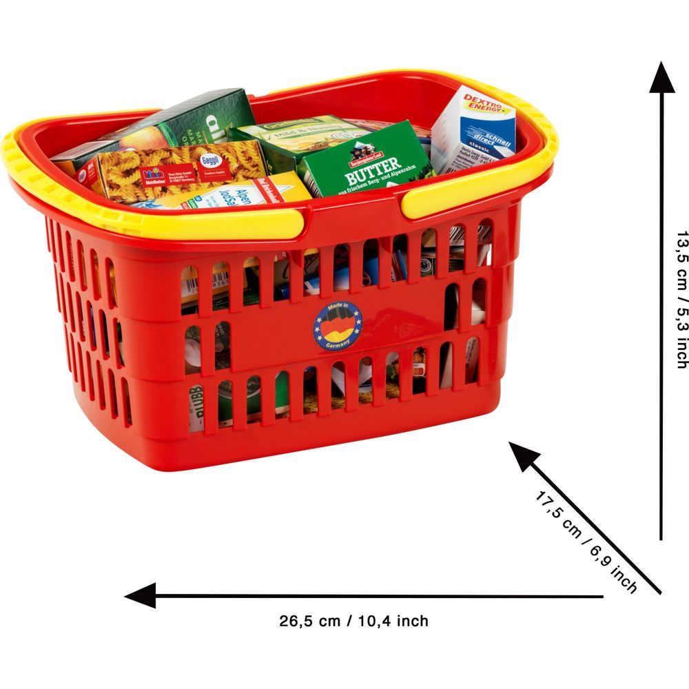 Un panier d'épicerie rouge à anse jaune, rempli d'épicerie et de dimensions.