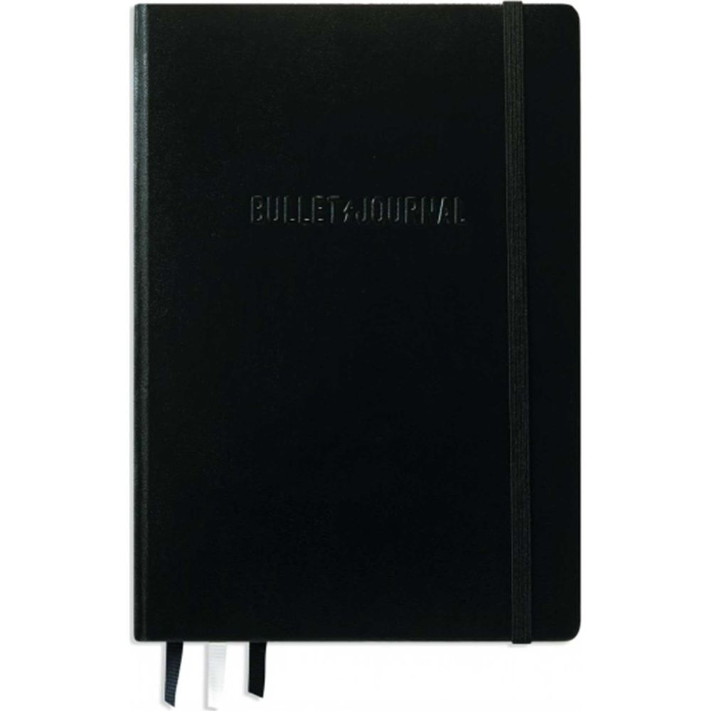 Taccuino nero con "BULLET JOURNAL" in rilievo e elastico.