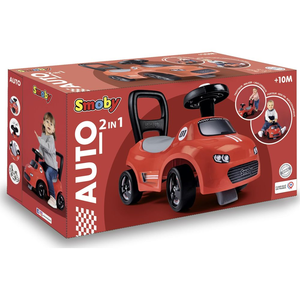 Scatola giocattolo Smoby 2 in 1 rossa con bambino e volante.