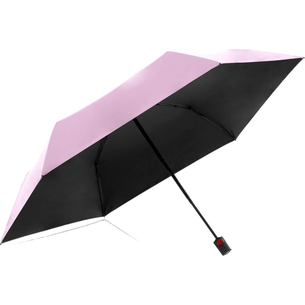 Ein aufgespannter Regenschirm mit rosa Außenseite und schwarzer Innenseite.